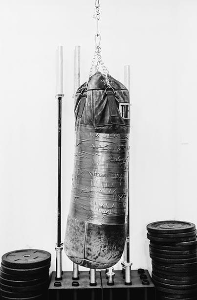Boxing bag, barbells, weight-lifting plates at tribestrength. Boxing bag, barbells, weight-lifting plates at tribestrength.