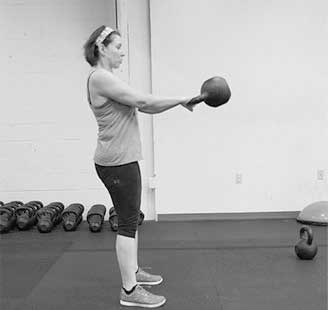 Kettlebell swing with perfect form at tribestrength.